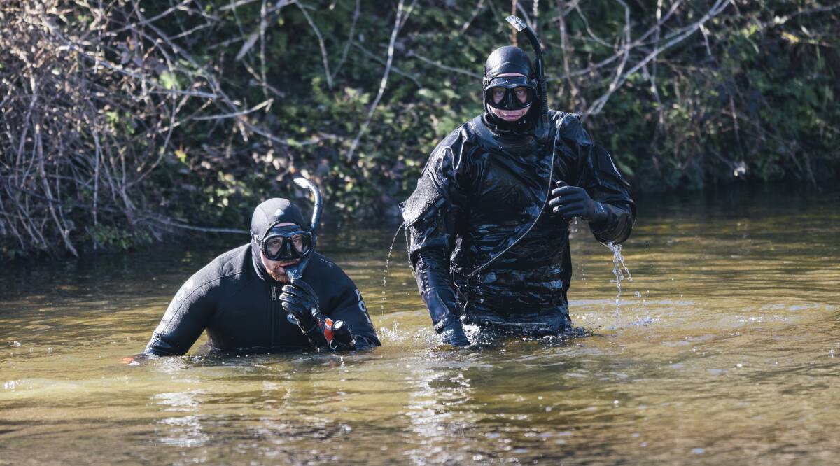Police divers searching the Queanbeyan River in Karabar on Saturday. Photo: Rohan Thomson