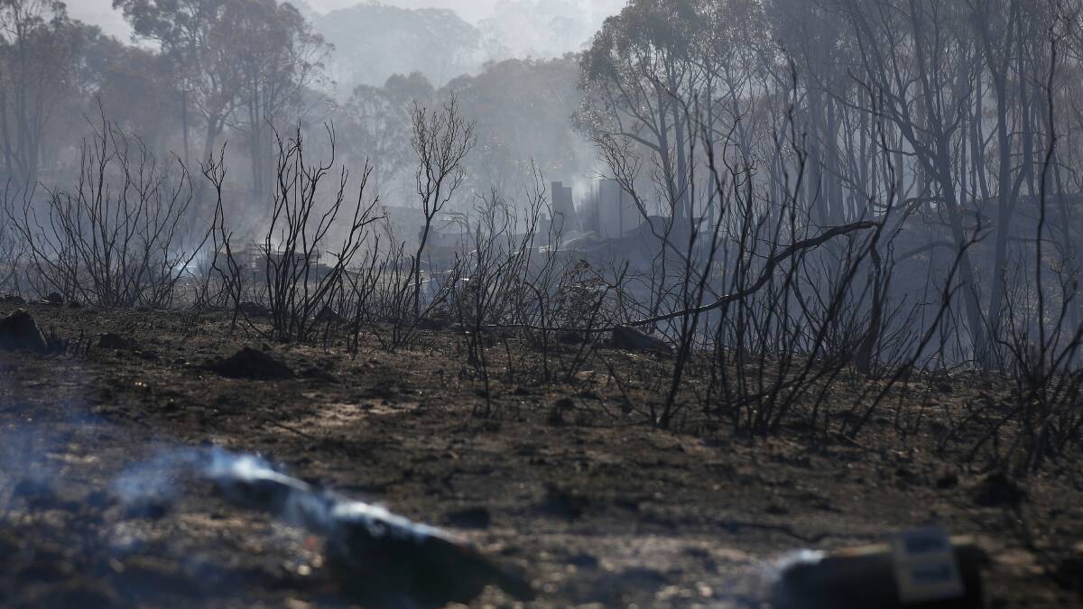 The smouldering remains of a property after the fire. Photo: Alex Ellinghausen