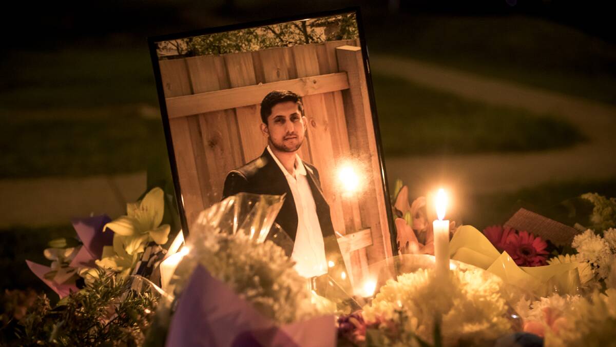 REMEMBERED: A candlelight vigil was held for Zeeshan Akbar three days after he was fatally stabbed. Photo: Sitthixay Ditthavong