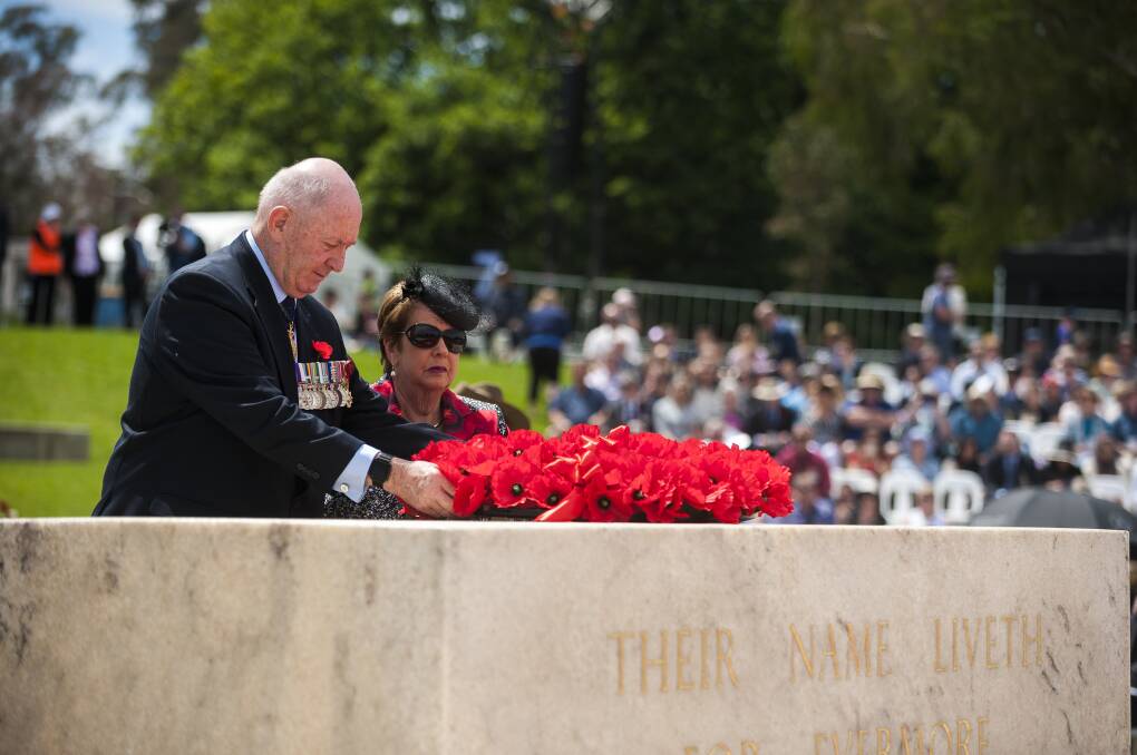 Governor-General Sir Peter Cosgrove lays a wreath on the Stone of Remembrance with his wife, Lady Lynne Cosgrove. Photo: Dion Georgopoulos