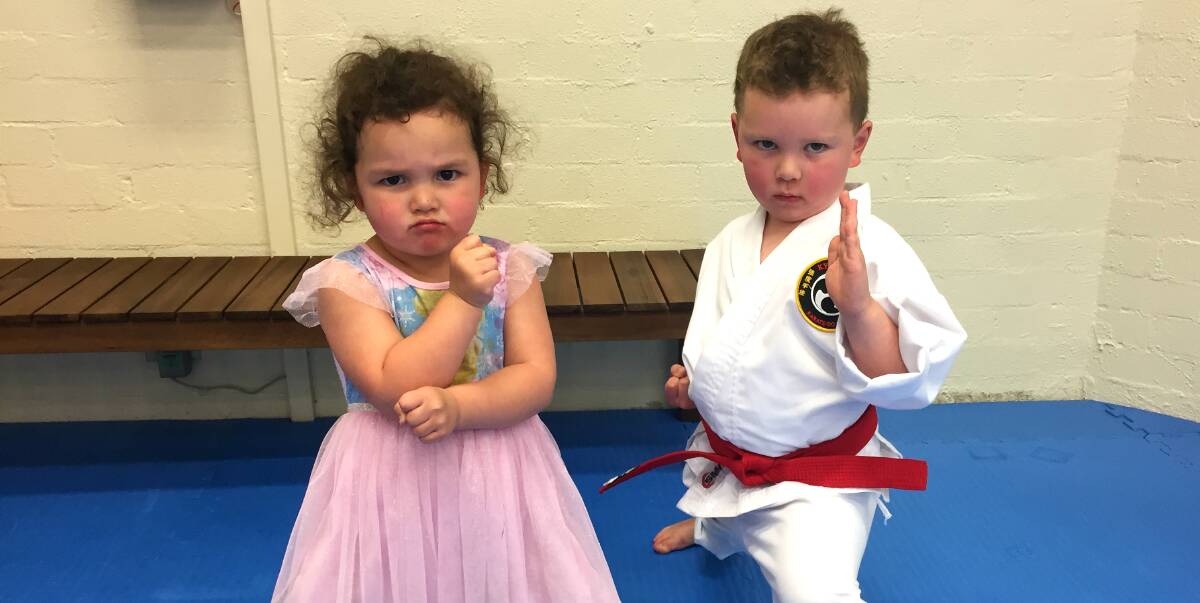 SERIOUS FOCUS: The Hinch-Parr children in the family dojo at Fyshwick. Kaitlyn is three and her brother Eric is five. Photo: Kimberley Le Lievre.