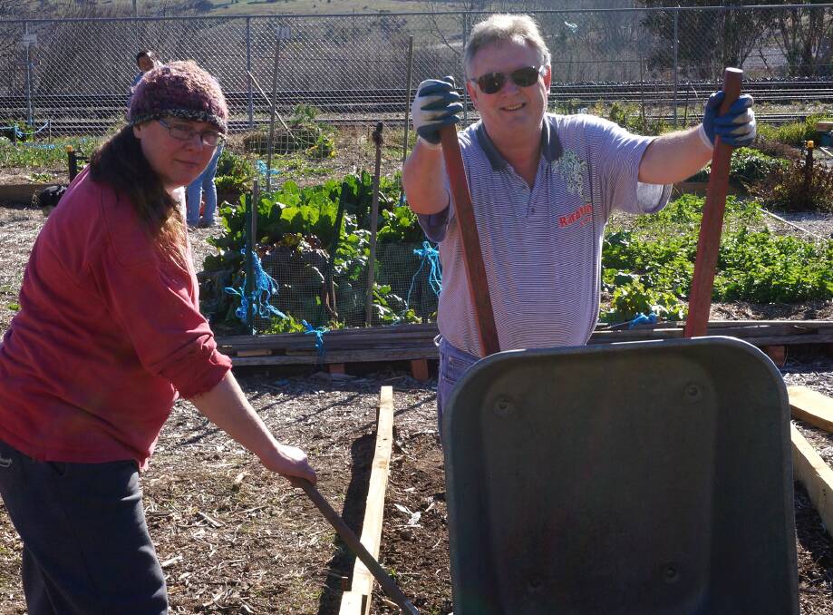 GARDEN GURUS: Community garden members Robyn Lawrence and Arthur Holland at a recent working bee. Photo: Katrina Willis.