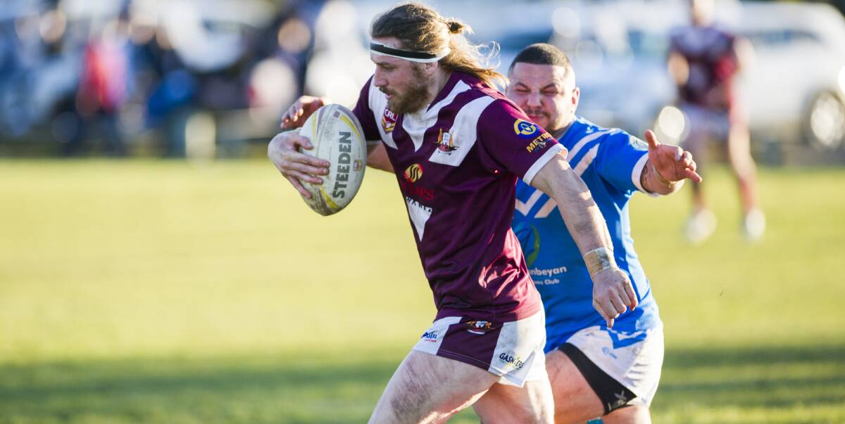 FINALS CHANCE: Queanbeyan Kangaroos player Adam Pearce tries to outrun a tackle from the Queanbeyan Blues as the cross-town rivals battled it out in the semi-final over the weekend. Photo: Rohan Thomson.