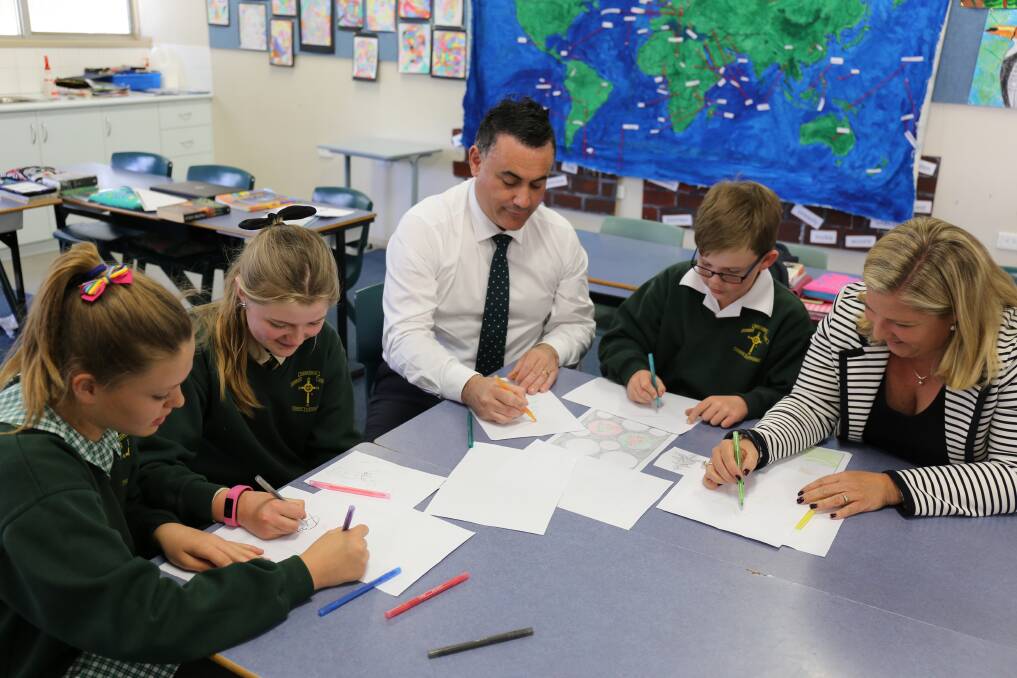 COMPETITION TIME: Member for Monaro John Barilaro with students at Cooma's St Patrick’s Parish School. Photo: Supplied.