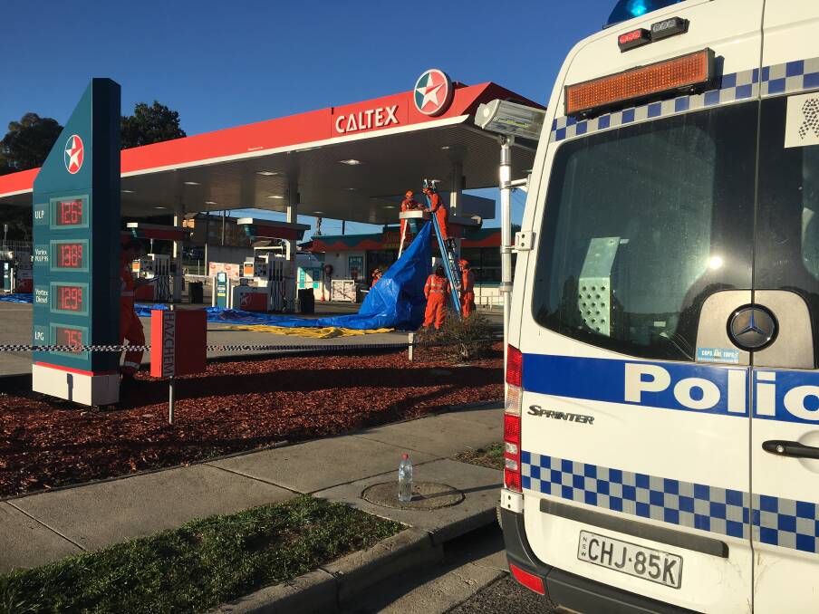 Police on scene at a service station in Queanbeyan after a fatal stabbing overnight. Photo: Karleen Minney

