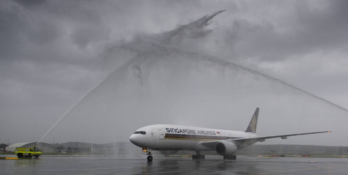 FANFARE: Singapore Airlines Boeing 777-200 ER flight SQ 291 arrived at Canberra Airport for the first time on Wednesday to a watery salute, heralding the start of a new international timetable  Photo: Jay Cronan