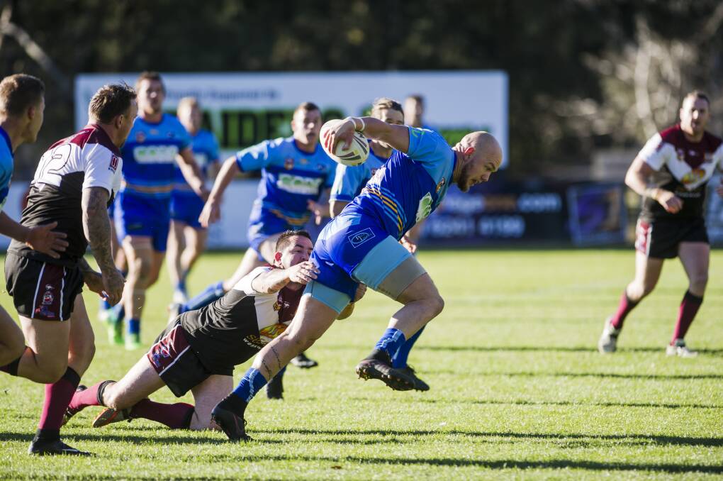 THRASHING: In the Canberra Raiders Cup, West Belconnen's Christopher Thorley gets taken down by Queanbeyan's Aaron Gorrell. Photo: Jamila Toderas