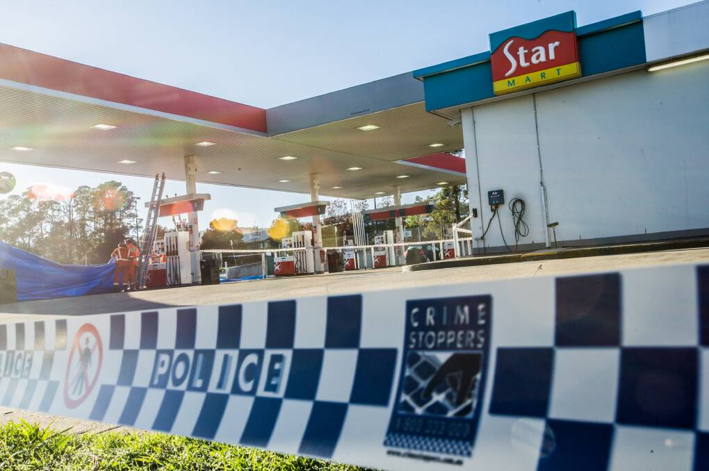 Police on scene at a service station in Queanbeyan after a fatal stabbing overnight. Photo: Karleen Minney
