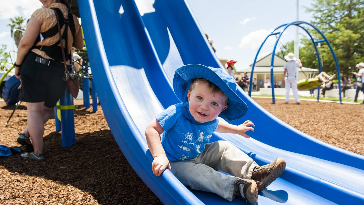 Queen Elizabeth Park reopens after $4 million renovations. Luke Purcell, 2, of O'Malley enjoys the new playground. Photo: Elesa Kurtz.