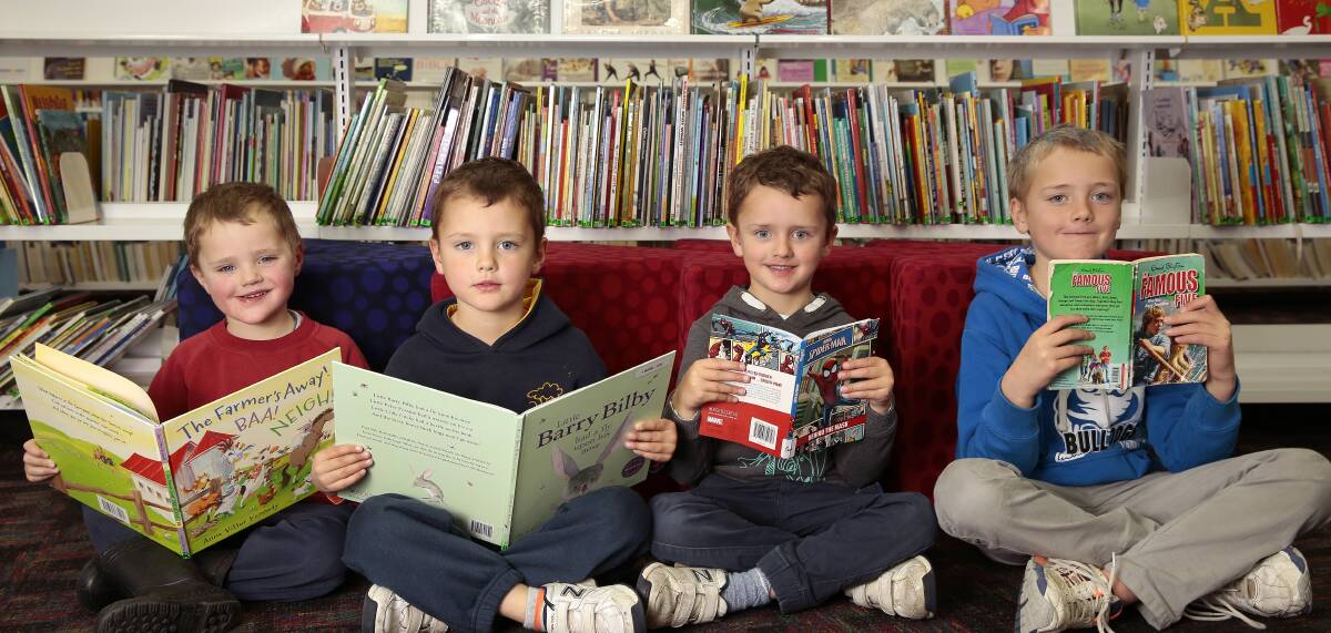 BOOKS GALORE: McRae brothers Callan, Quaid, Rohan and Liam, of Charnwood reading at Gungahlin Library in 2015. Photo: Jeffrey Chan.