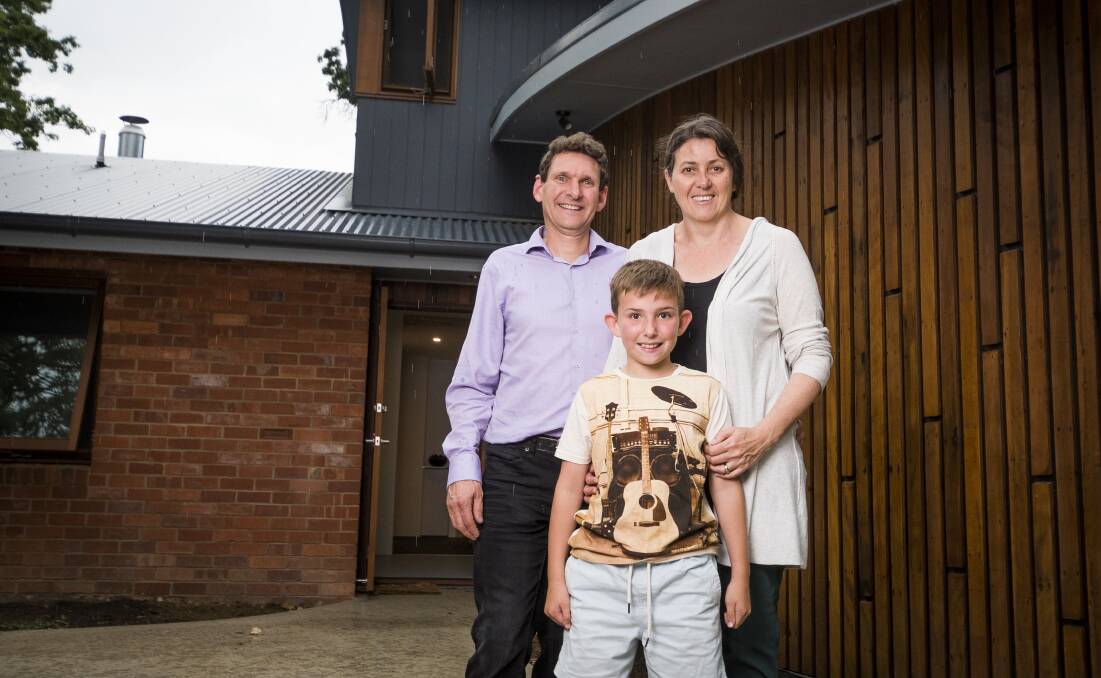 Michael Dobbie and Ruth Arkell, with daughter Sophia have recycled their old home by maximising the amount of material reused from their old house.  Photo: Dion Georgopoulos.