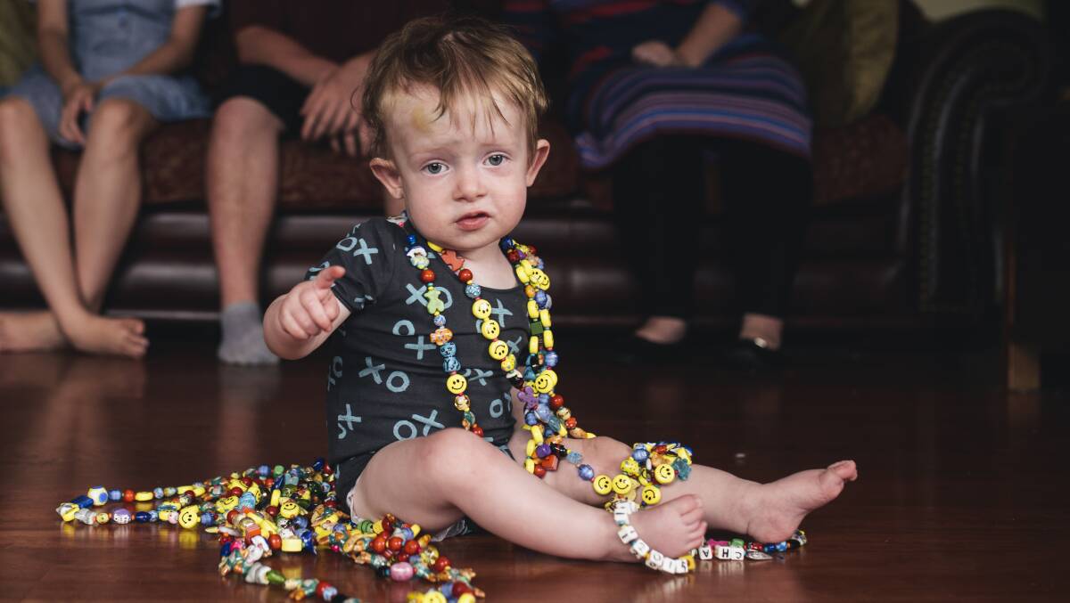 BRAVE HEART: Charlie Clode, at 16 months old, with the more than 800 heart beads he has collected during his time spent in hospital. Photo: Rohan Thomson.