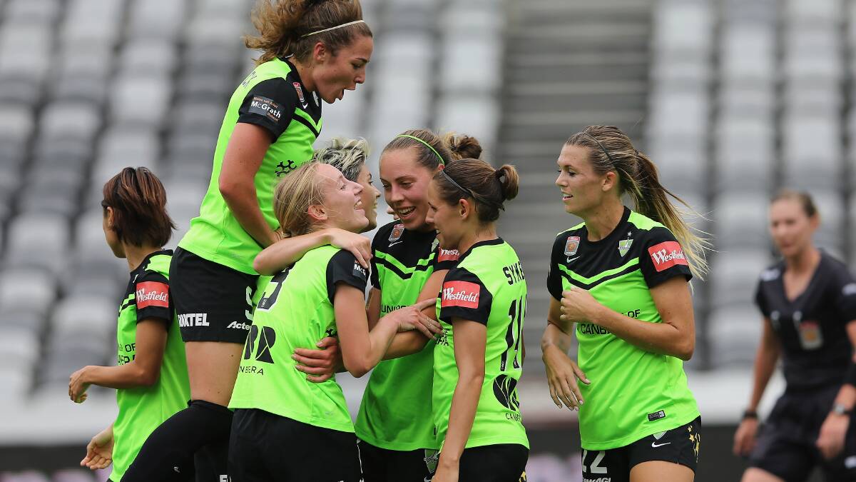 WINNERS ARE GRINNERS: Canberra United celebrate a goal during the round seven W-League match between Canberra and Brisbane at Central Coast Stadium. Photo: Ashley Feder/Getty Images