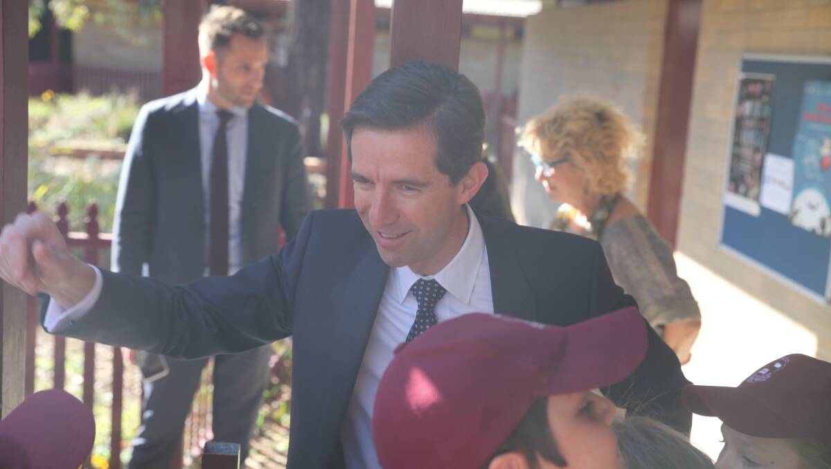 High fives all round for Mr Birmingham at Queanbeyan Public School. Photo: James Hall.