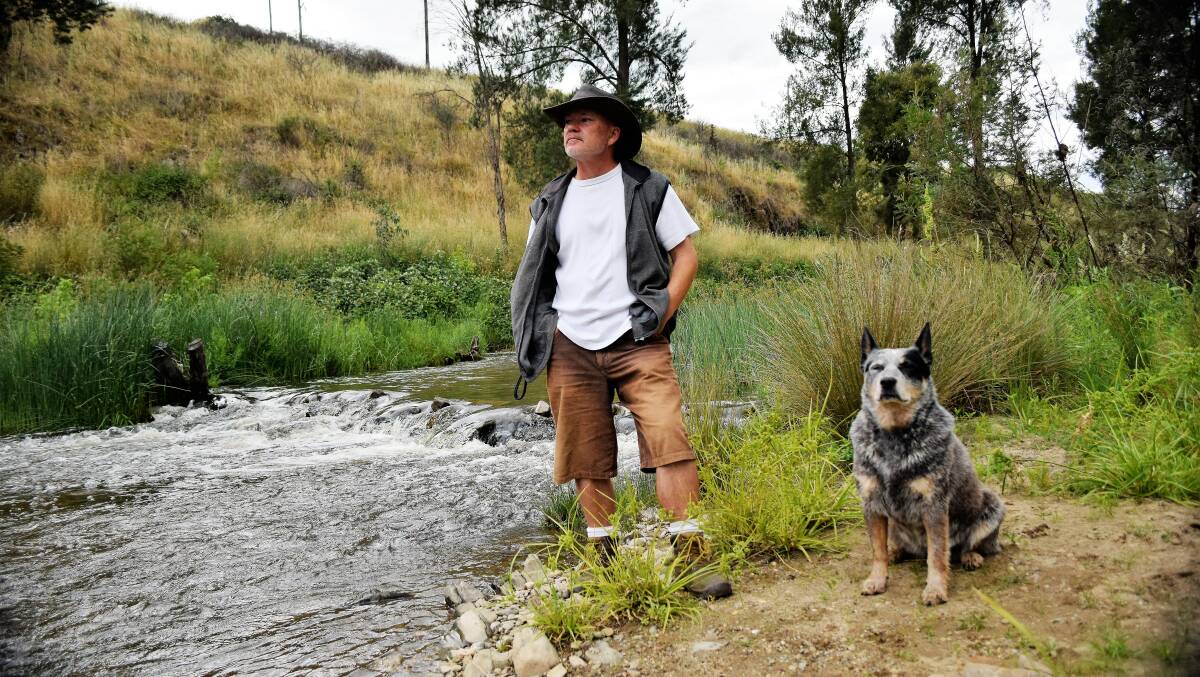 OAKS ESTATE: Unit dwellers, Karl Steiner, 50, and his dog, Sheba, walk Oaks Estate river corridor heritage trail every day. Mr Steiner said it made a massive contribution to his quality of life. "It's a big reason why I stay here," he said. Photo David Ellery.