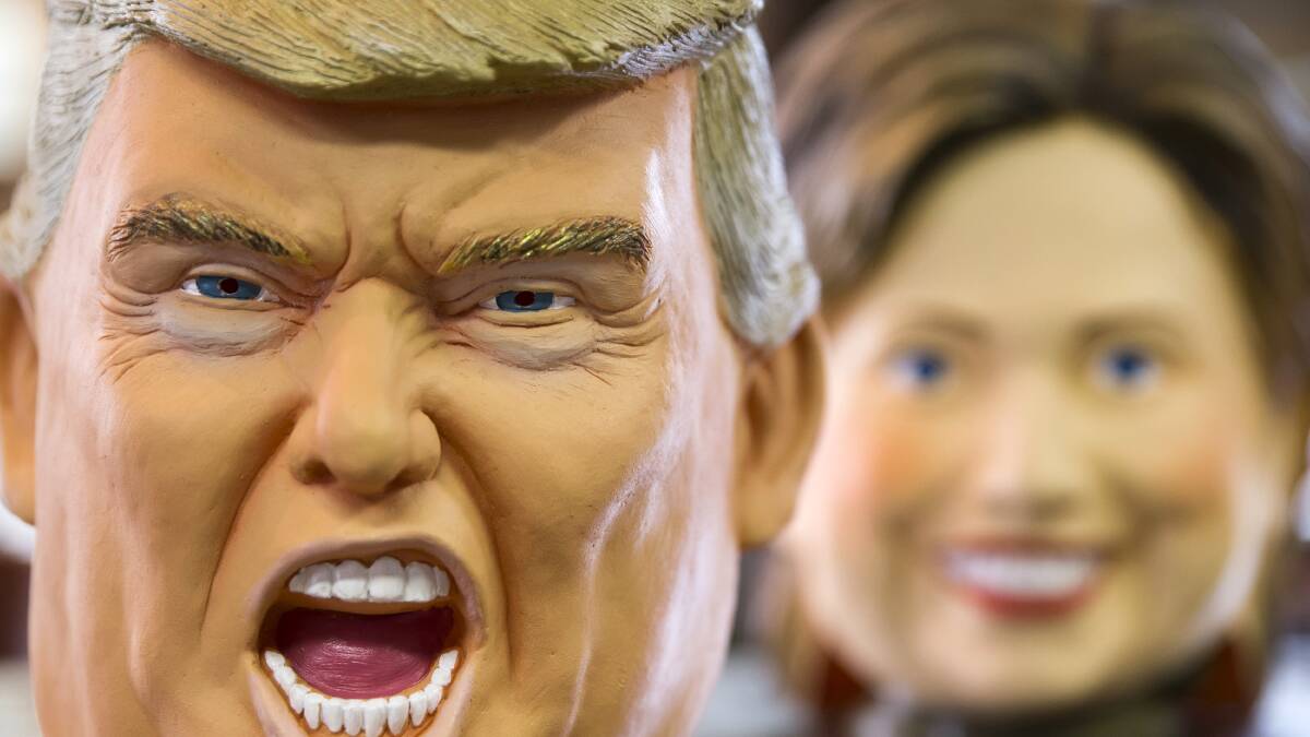 Rubber masks in the likeness of Republican presidential candidate Donald Trump, left, and Democratic presidential candidate Hillary Clinton are made in Japan. Photo: Tomohiro Ohsumi/Getty Images