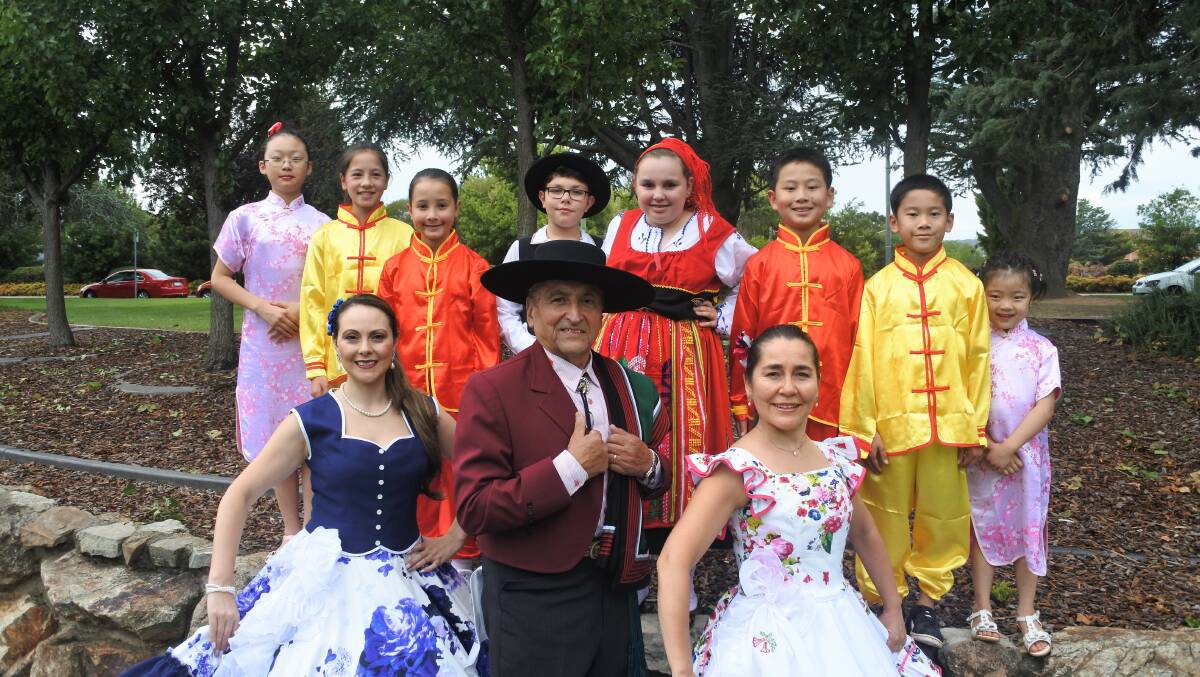 Performers from the local Chinese and Chilean communities gather in Town Park to show off their colourful costumes ahead of the Multicultural Festival. Photo: Elliot Williams