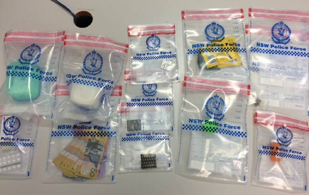Officers from Strike Force Joanie have seized cash and drugs as part of investigations into the distribution of ice in the Queanbeyan area. Photo: NSW Police