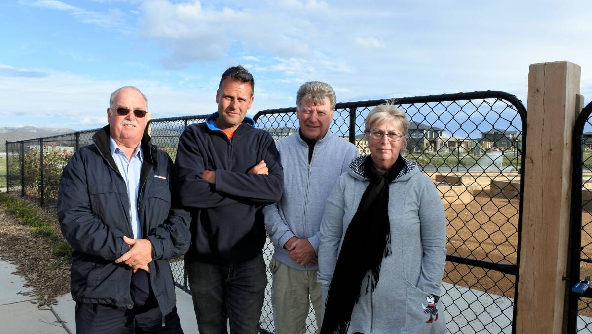 Ian Keys, Nicholas Luketic, Paul Finley and Carrol Keys are unhappy with the addition of the Googong Community Garden at the end of their street. Photo: Elliot Williams