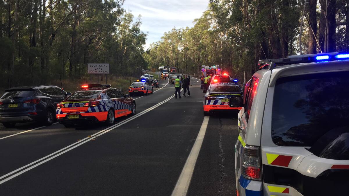 Emergency services respond to the fatal crash on the Princes Highway. Photo: Damian McGill