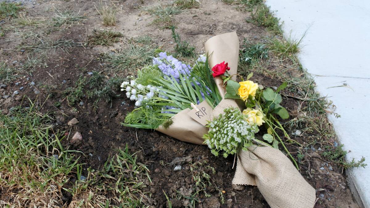 Flowers left at the scene of a fatal motorcycle accident on Friday. Photo: Elliot Williams