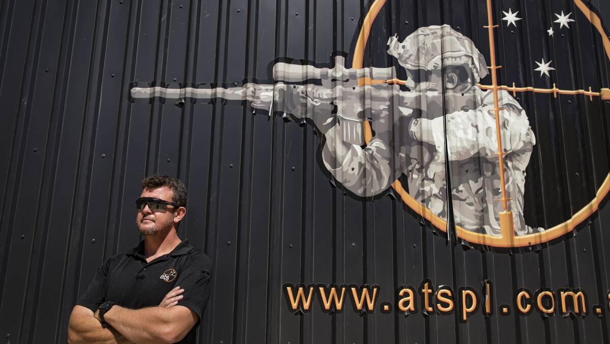 CEO of Australian Targeting Systems Paul Burns outside of a mobile firing range that enables students to train under virtual scenarios. Photo: Sitthixay Ditthavong