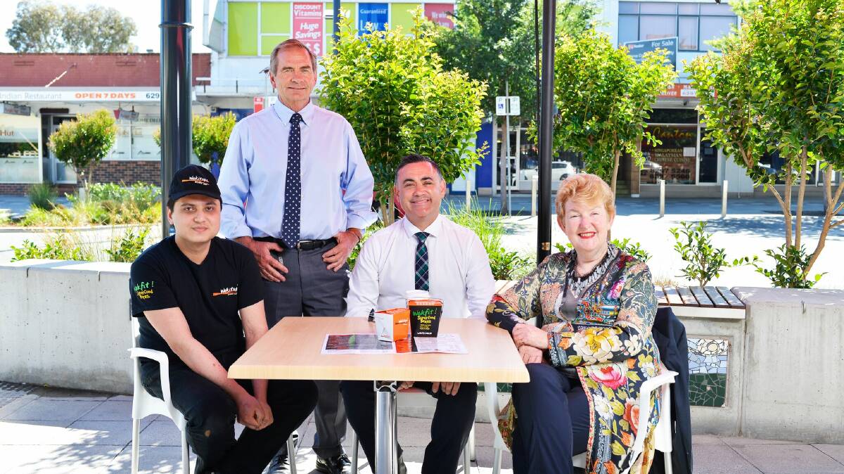 Wokitup Queanbeyan owner Jamie Singh, Mayor Tim Overall, Deputy Premier John Barilaro and NSW Small Business Commissioner Robyn Hobbs enjoying the new outdoor dining at Wokitup Queanbeyan. Photo: Supplied