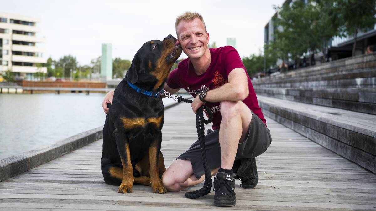 Jarrad Houghton with his dog Basil came to the rescue of a child that fell into the lake at Kingston Foreshore. Photo: Dion Georgopoulos