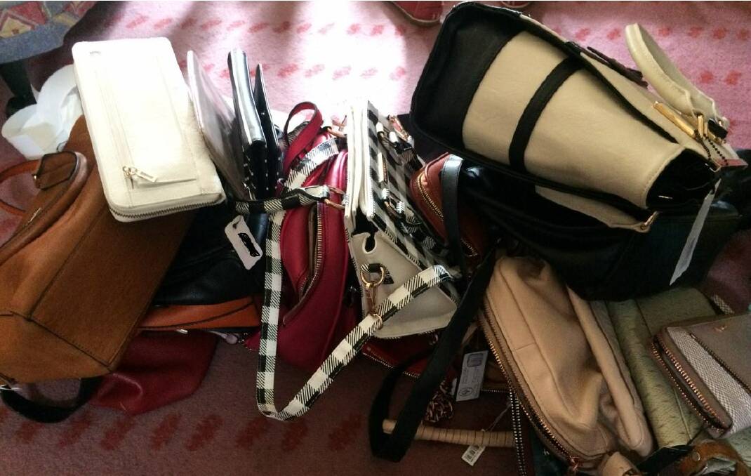 Designer handbags seized during the raid. Photo: NSW Police