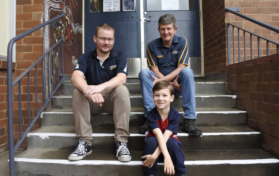 Councillor Kenrick Winchester joined by his dad Wayne and son Harry. The Winchesters have been a fixture at Queanbeyan East. Photo: Elliot Williams