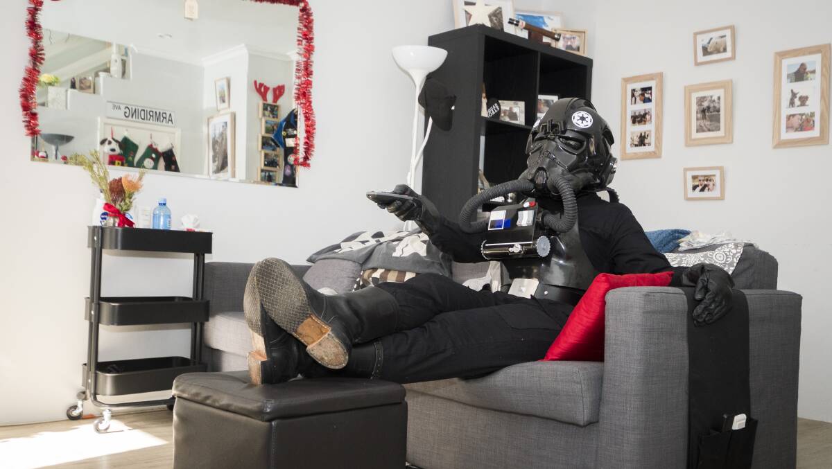 Queanbeyan local Amy Armriding enjoying some TV in her TIE Fighter outfit. Photo: Dion Georgopoulos