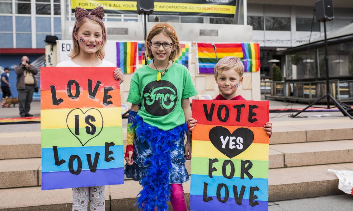 Nia 9, Evi 9, and June 6 showing their support for marriage equality at the rally in Canberra on September 2. Photo: Jamila Toderas