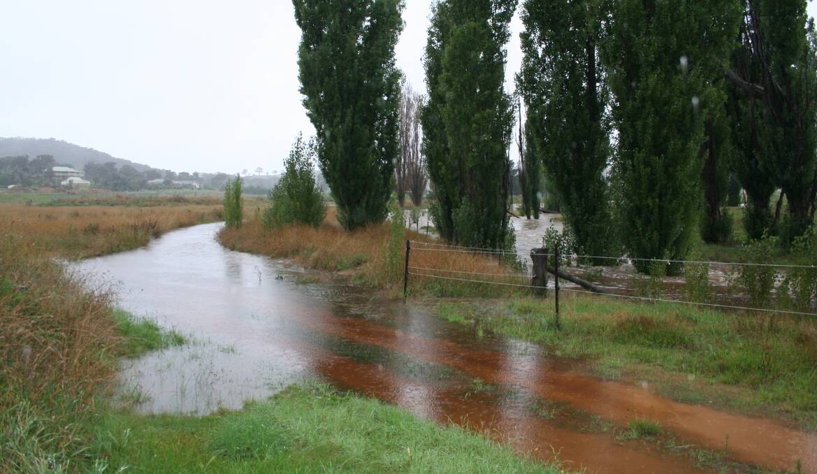 Former owners say rain water could pool for days after particularly heavy events. This photo was taken by neighbours in 2012. Photo: Supplied