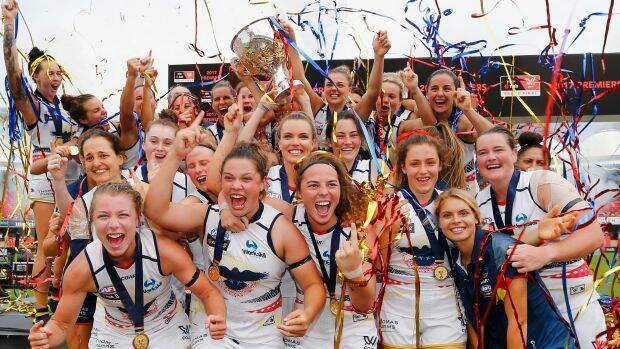 Crows players celebrate during the AFL Women's Grand Final between the Brisbane Lions and the Adelaide Crows on March 25, 2017 in Gold Coast, Australia. (Photo by Jason O'Brien/Getty Images) Photo: Getty Images 