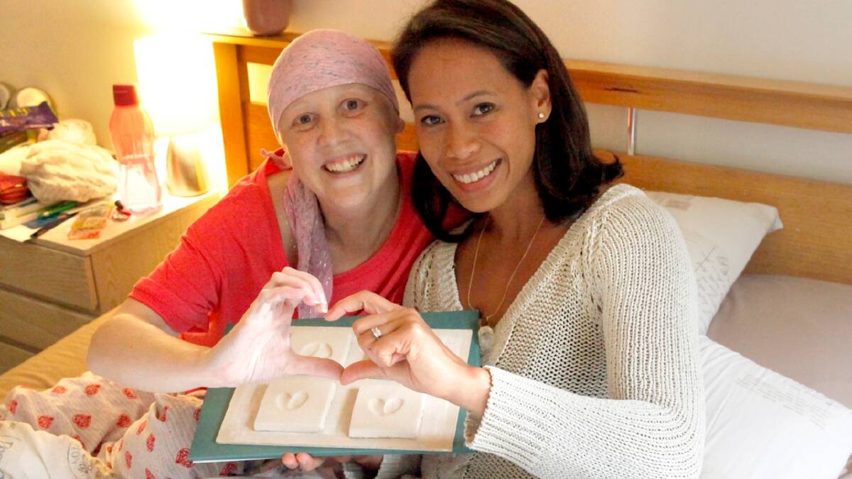 Heartfelt: Connie Johnson with artist Marie Ramos, who is making an art work honouring Connie through 2000 ceramic tiles. Photo: Supplied
