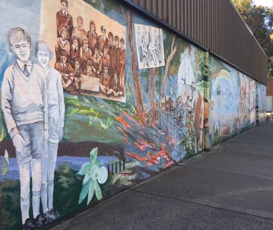 Upgrade: The mural has been on the wall of the community centre since 2005. It's being renewed ahead of the centre's 40th anniversary in April 2018. Photo: Supplied