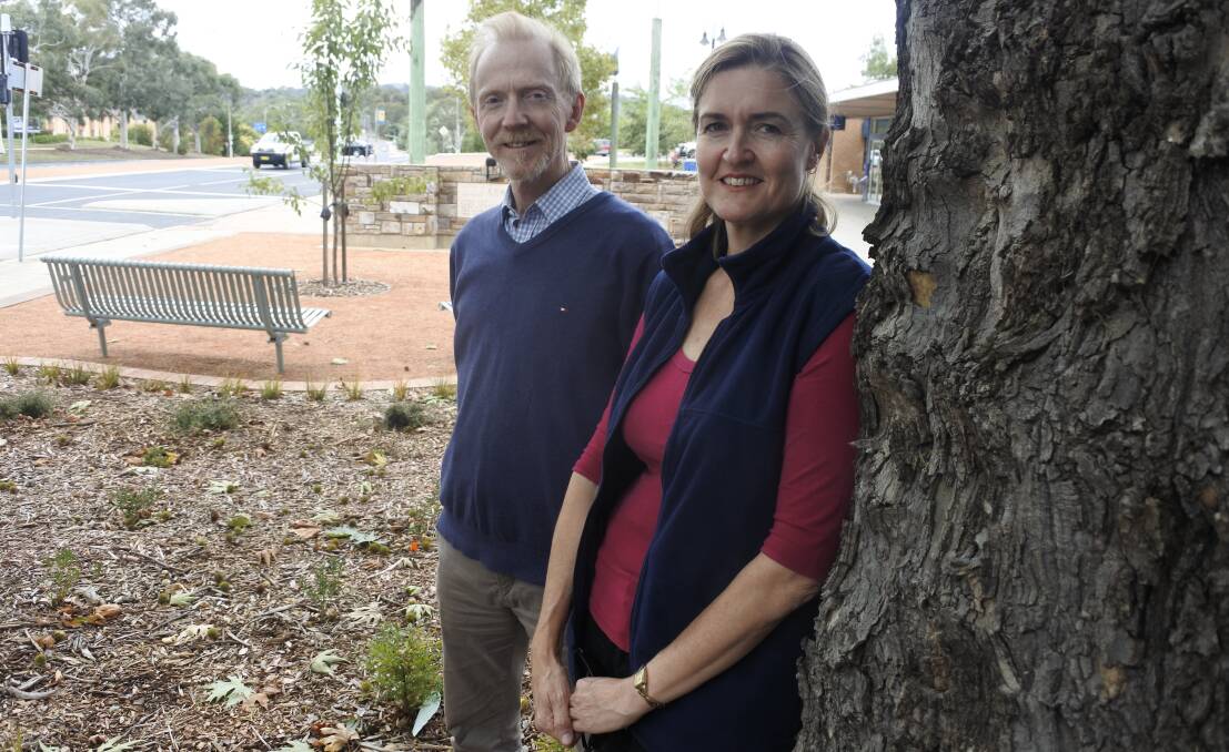 Transformation: Helen Vaughan and Evan Mann at the new gardens outside Curtin shops. The renovation was several years in the making. Photo: Andrew Brown