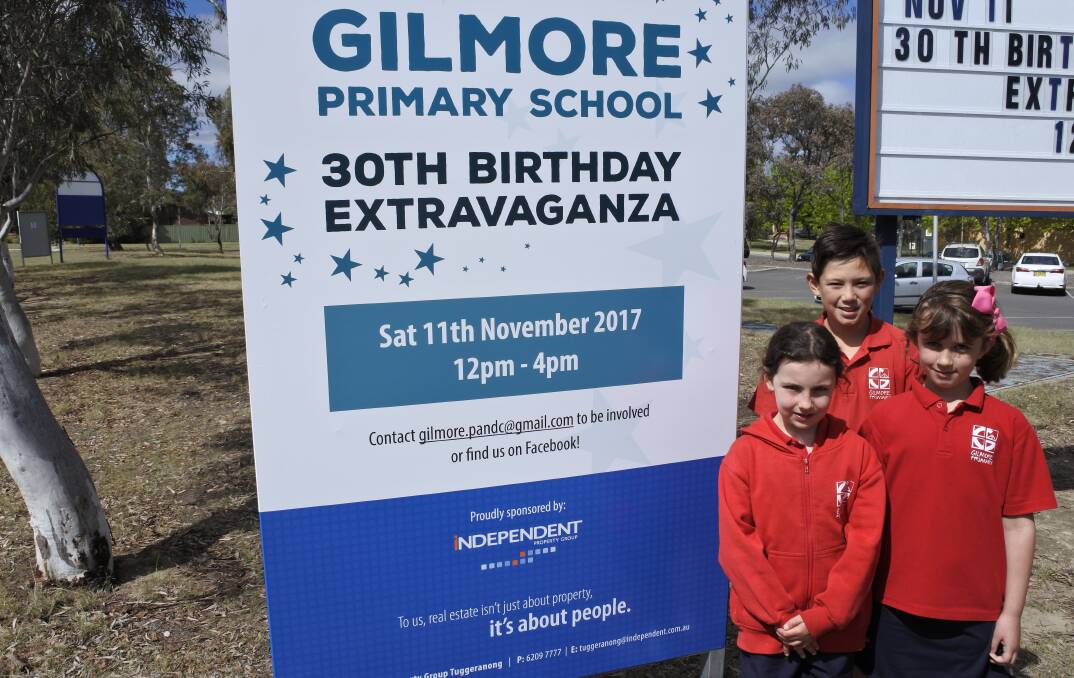 Birthday fete: Gilmore Primary School students Ryan Cunanan, Hannah Conron and Lucy Dawes are getting ready for the big event. Photo: Andrew Brown