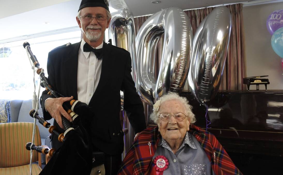 Triple figures: Nancy McLean celebrated her 100th birthday with the help of a pipe band led by John Griggs. Photo: Andrew Brown