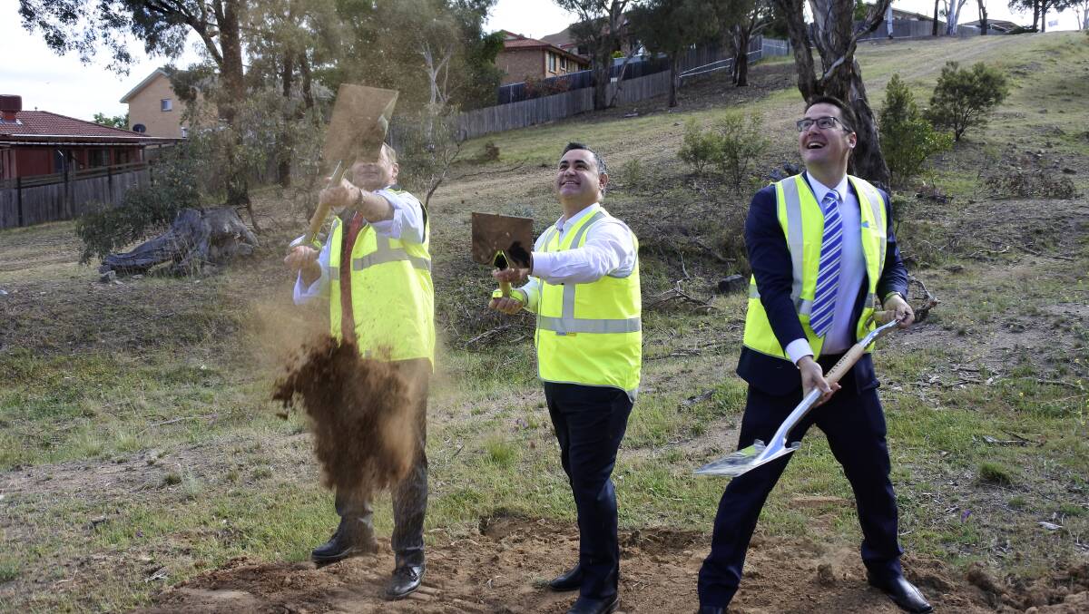 Construction start: The first sod of the Ellerton Drive Extension being turned by QPRC mayor Tim Overall, Monaro MP John Barilaro and ACT Senator Zed Seselja. Photo: Andrew Brown