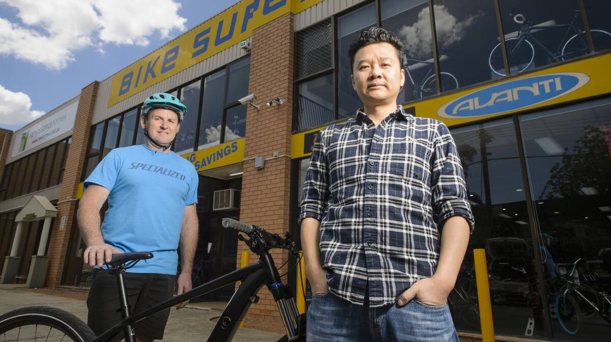 Pedal power: Mitchell Bike Superstore managing director Darren Symons and Mitchell Traders Association secretary Julian Kusa. Photo: Sitthixay Ditthavong