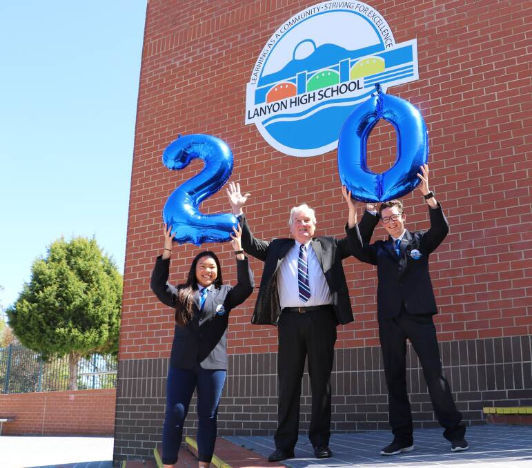 Celebration: Samantha Ruangsuk,  principal Bill Thompson and James Wolf mark the 20th birthday of Lanyon High School in Conder. Photo: Supplied