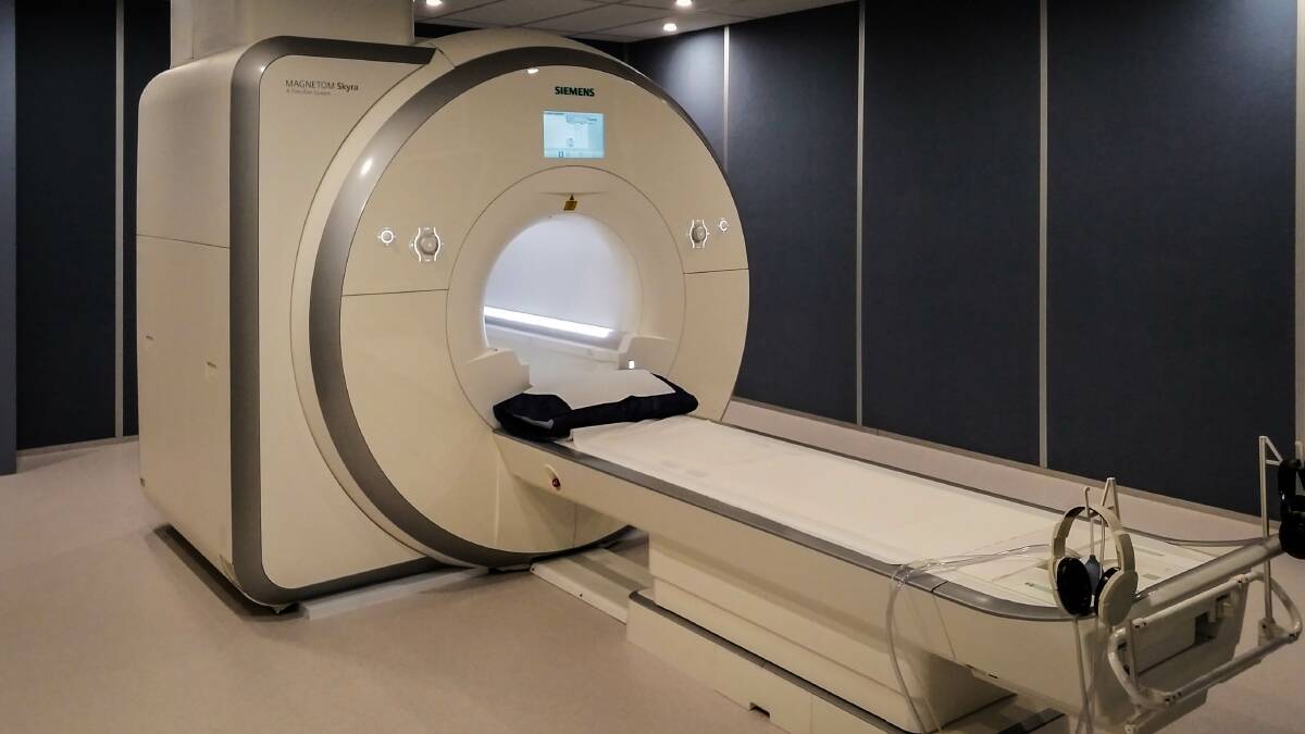This is the MRI machine. It takes cross-sectional images too, but the detail is much greater. This one's 3T high-field magnet raises image quality even further.