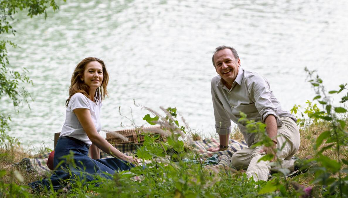FRENCH FOLLIES: Anne (Diane Lane) and Jacques (Arnaud Viard) stop and smell the roses (and picnic on the grass) in Paris Can Wait.