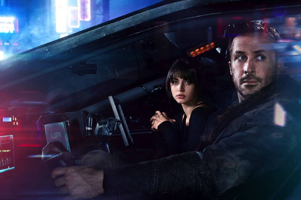 BLEAK VISION: K (Ryan Gosling) with his replicant assistant Joi (Ana de Armas) ready to hunt down rogue robots in Blade Rnner 2049.