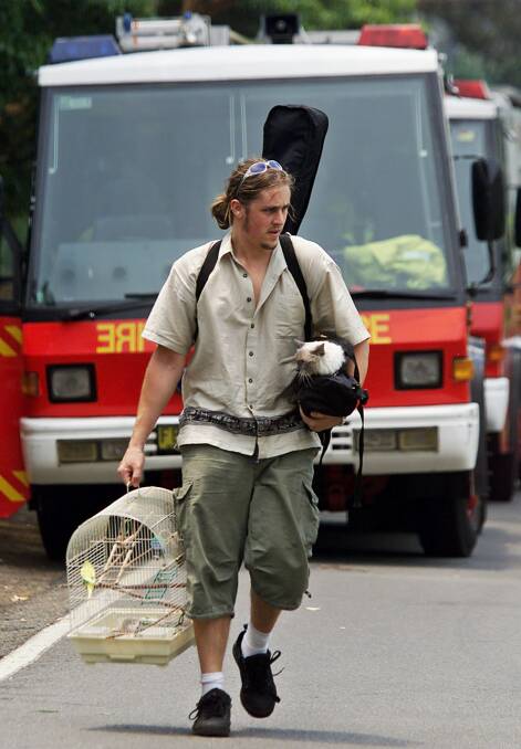 THINK IT THROUGH: Do you have a plan for bushfire evacuation that includes your pets? Photo: Reuters\David Gray