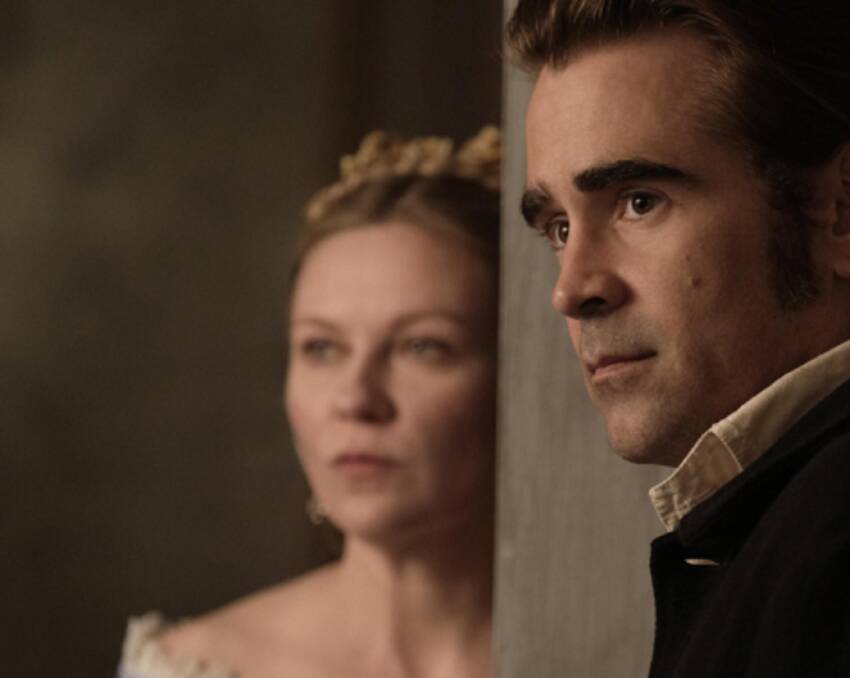 THROUGH A VEIL: Kirsten Dunst and Colin Farrell star in The Betrayed, a dark, Southern Gothic tale of heightened emotion.