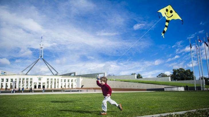 Charlie Lansdown-McCulloch, 5, of Warramanga, marks Global Wind Energy Day outside Parliament House. Photo: Rohan Thomson