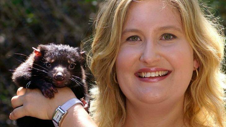 Geneticist Kathy Belov with a devil pup. Photo: Sydney University
