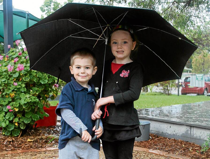COOTAMUNDRA: Cootamundra Pre-School’s Darius Close and Darcy Mitchell make sure they’re equipped to beat the rain last Friday. The rain, which included around the 30mm mark in most areas last Wednesday and consistent falls on Friday, has come at a good time ahead of  sowing for district farmers.   